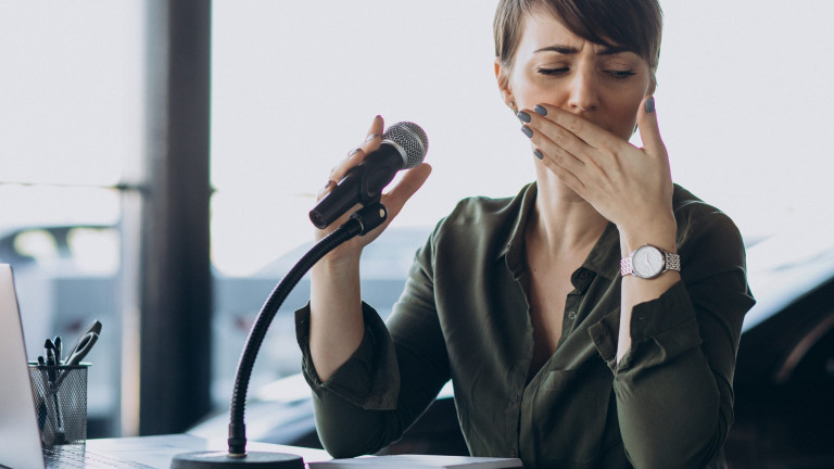 Young woman recording voice acting at studio